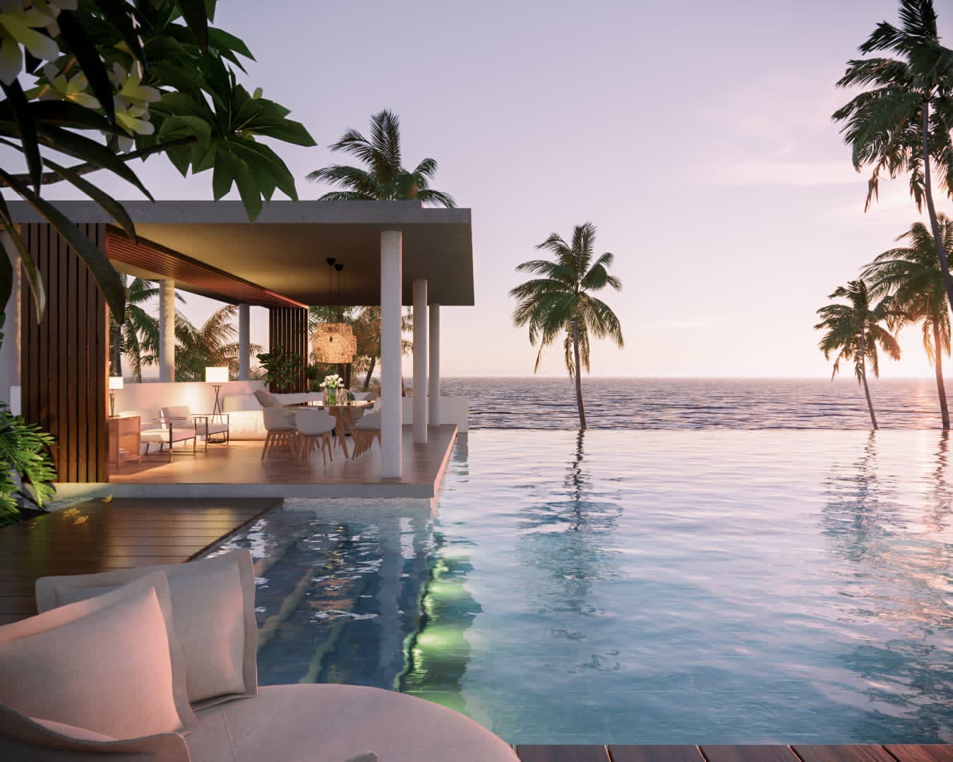 Beachfront pavilion with infinity pool at sunset